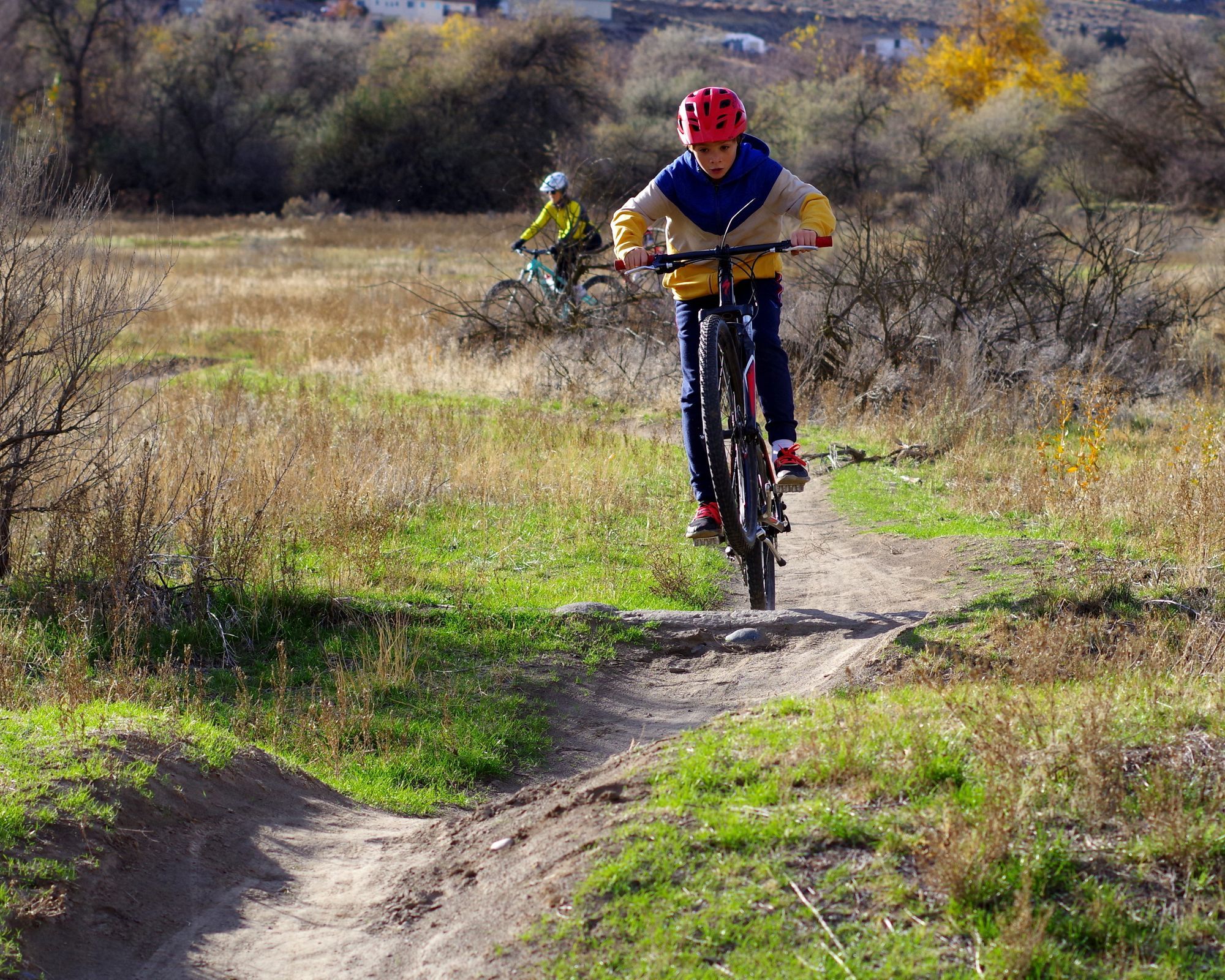 Image shows children riding bikes on a Chamna trail