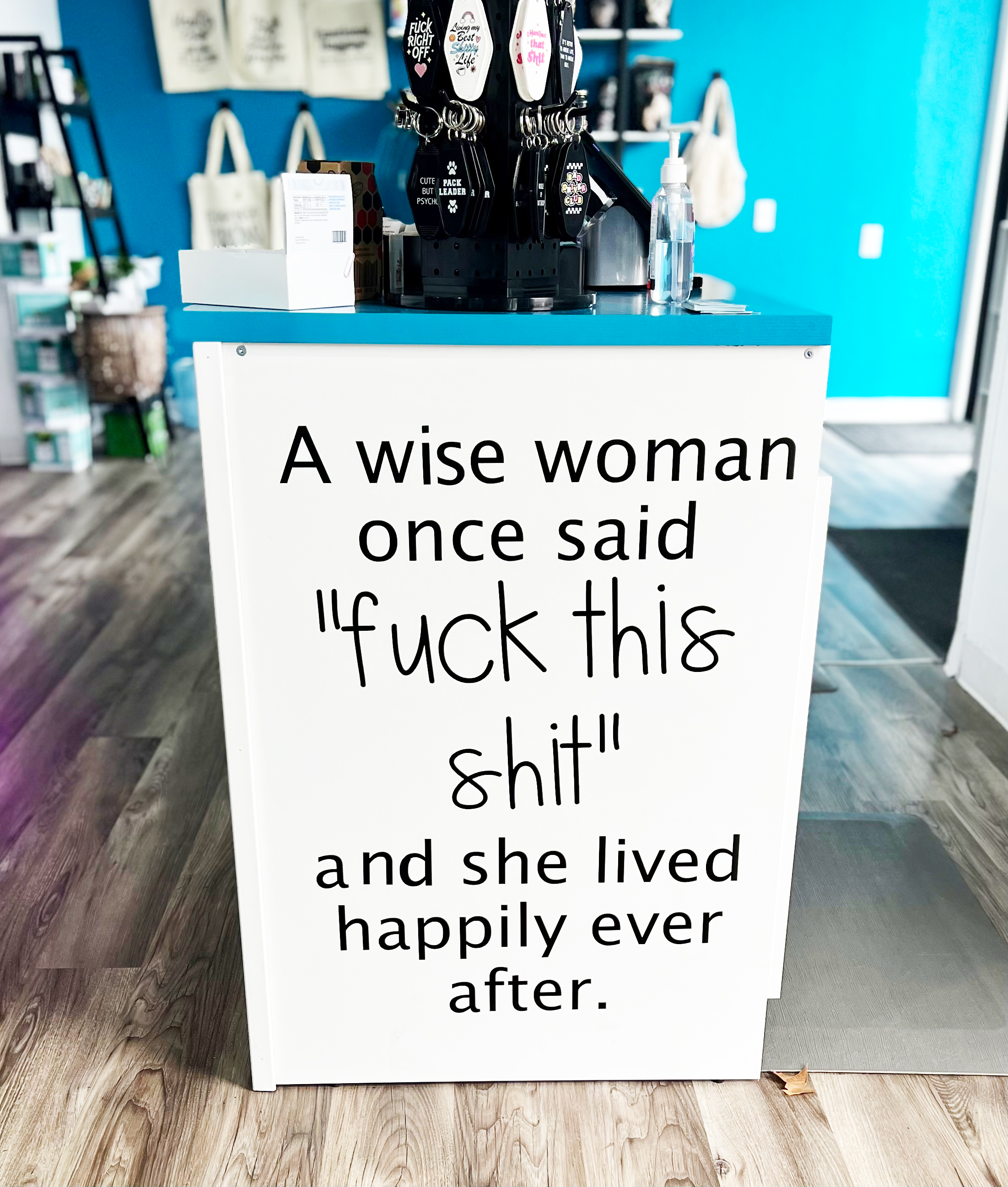 Sign near the entryway of The Teal Box that reads: "A wise woman once said ‘Fuck this shit’ and she lived happily ever after.”