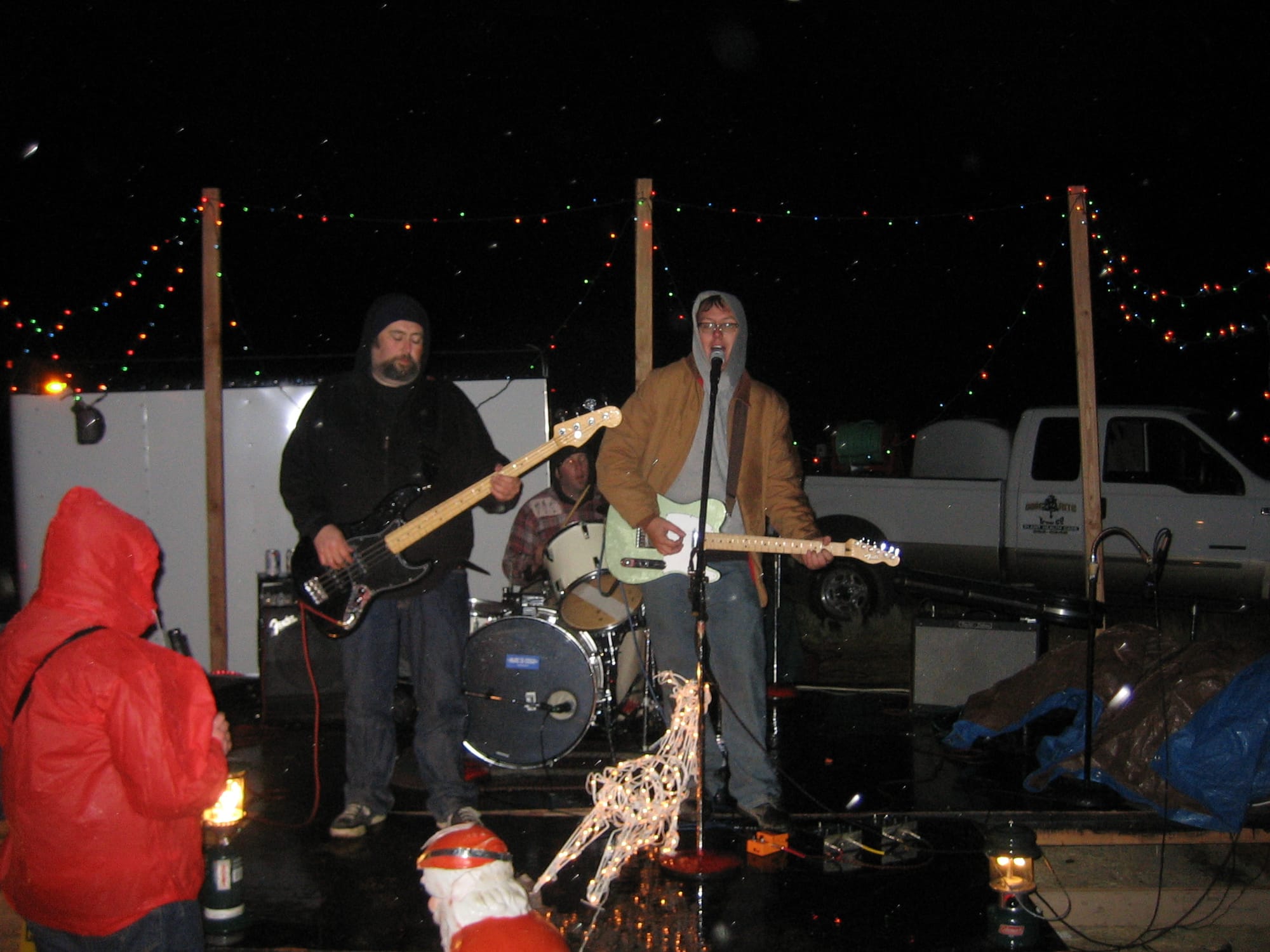 An image of John Reed playing with the band.